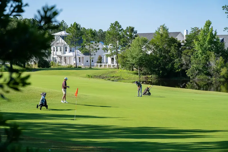 Golf beside the coastal cottages of the community
